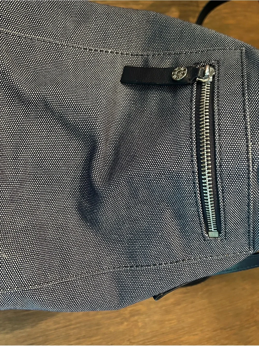MZ Wallace navy canvas tote with leather pocket and handles